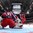 KANATA, CANADA - APRIL 9: Russia's Nadezhda Alexandrova #31 sprawls to cover the bottom of the net during bronze medal round action at the 2013 IIHF Ice Hockey Women's World Championship. (Photo by Jana Chytilova/HHOF-IIHF Images)